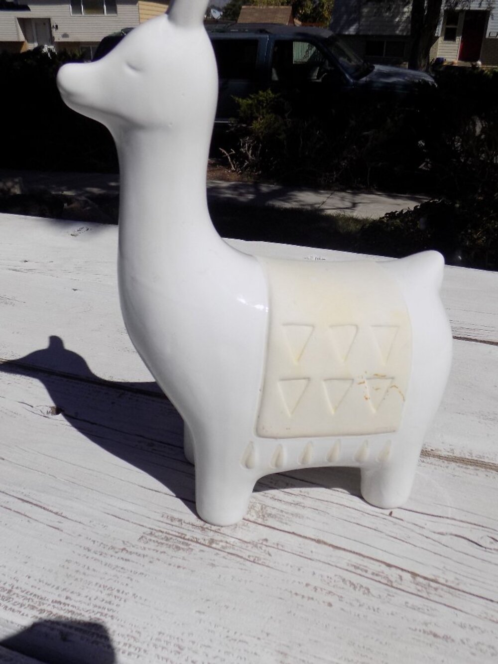 CERAMIC LAMA HAS Black MARKS and other ON THE SIDE OF IT